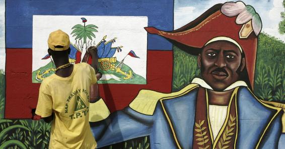 Un niño haitiano pinta un retrato del difunto gobernante Jean Jacques Dessalines para decorar una calle de Puerto Principe Eduardo MuñozReuters