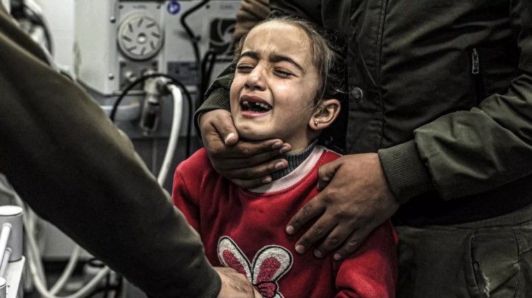 A girl mourns the death of her relatives who were killed by Israeli bombardment, at the European Hospital in Khan Yunis in the southern Gaza Strip on December 31, 2023. AFP 2.jpg